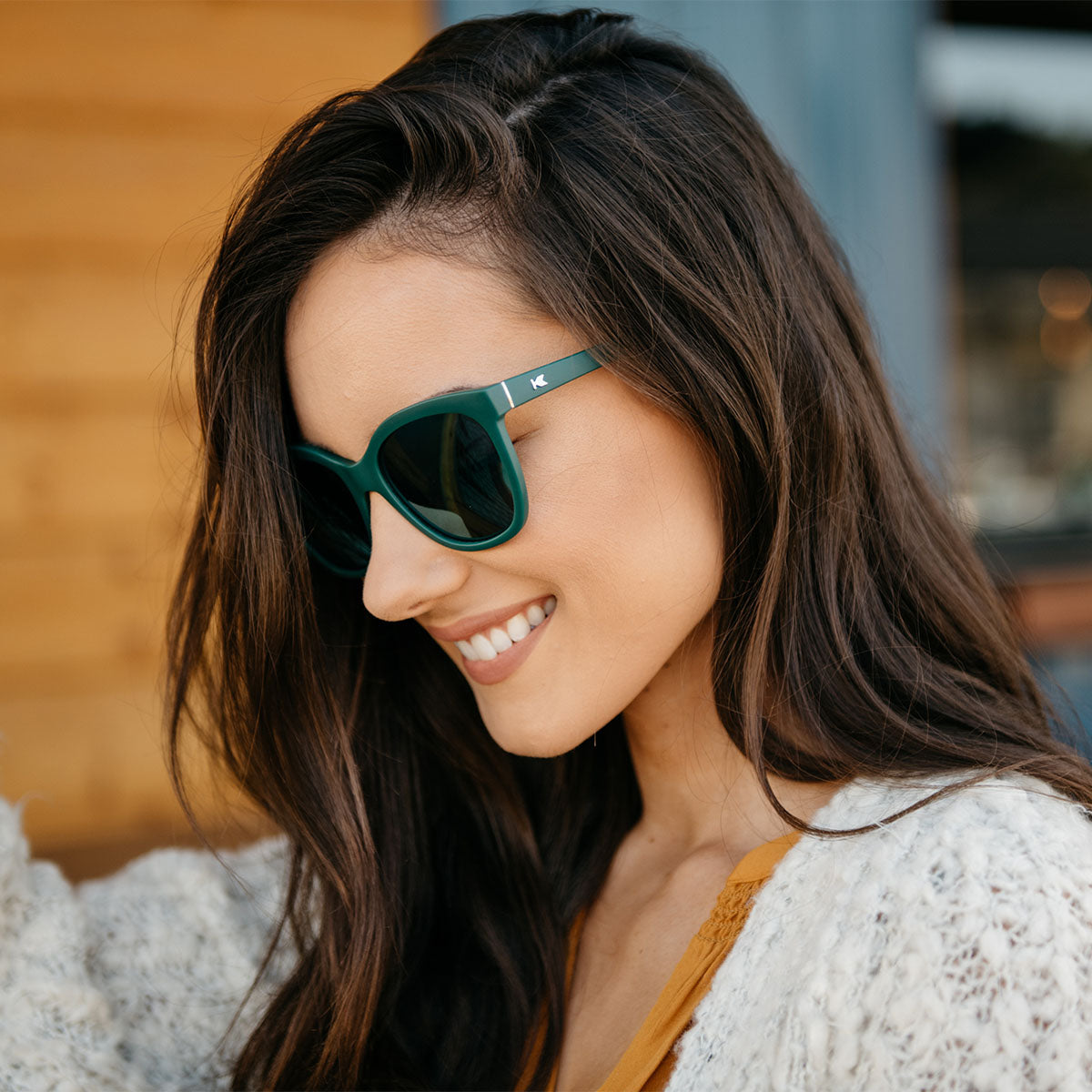 Woman wearing Knockaround Deja Views polarized sunglasses