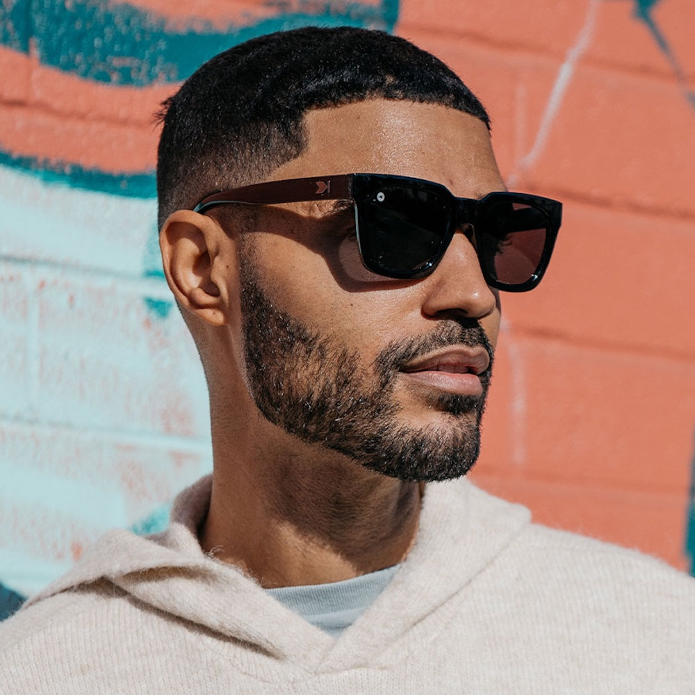 Man wearing Piano Black Songbird sunglasses