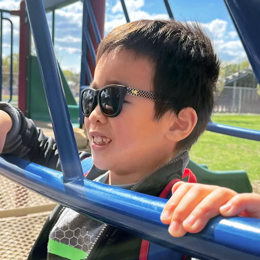 Kids Sunglasses with glossy Fronts and Checkerboard Arms with Polarized Black Smoke Lenses, Model