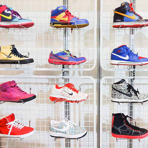 Sneaker collection displayed on wall rack