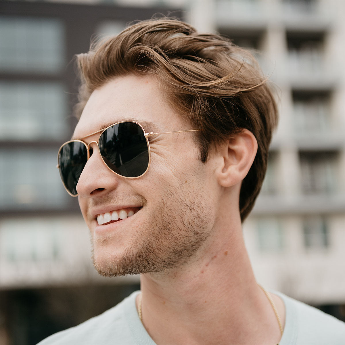 Man wearing Knockaround Mile Highs aviator sunglasses