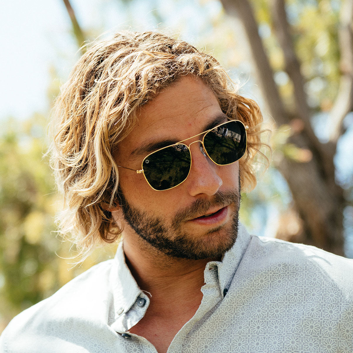 Man wearing Knockaround Mount Evans polarized aviator sunglasses