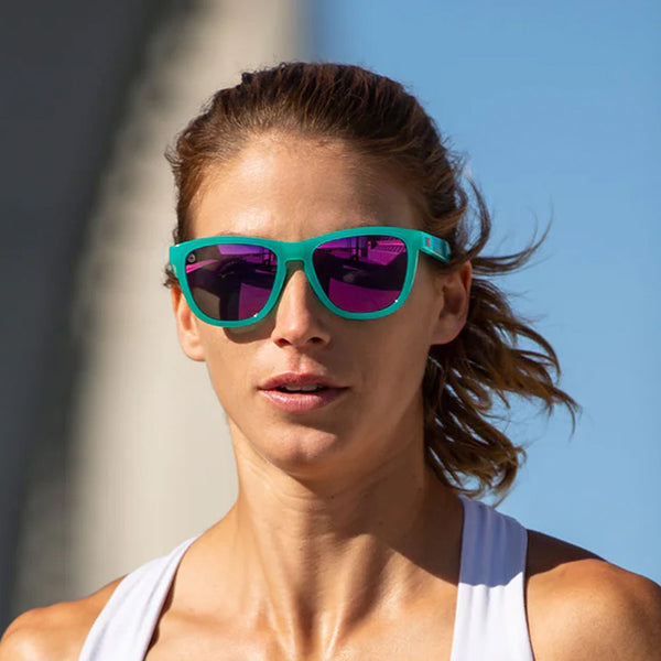 Woman wearing Knockaround Aquamarine Fuchsia Premium Sports Sunglasses