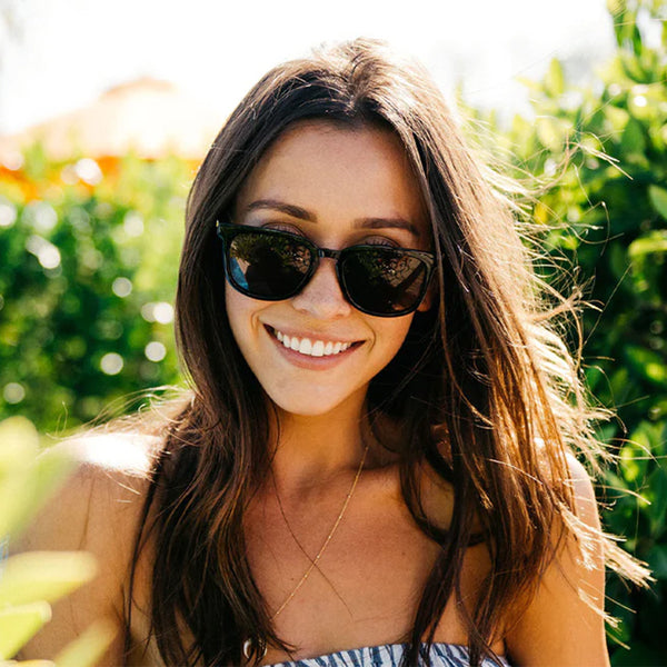 Woman wearing Knockaround Glossy Black Tortoise Shell Fade Amber Paso Robles Sunglasses