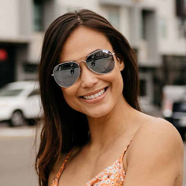 Woman wearing Knockaround Silver Silver Smoke Mile Highs Sunglasses