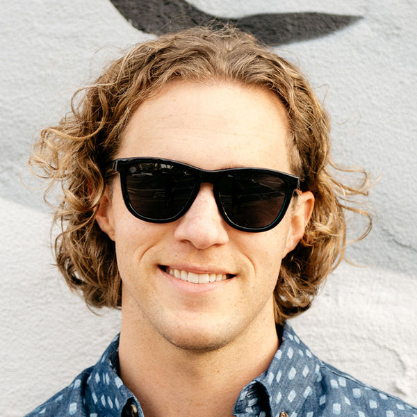 Man wearing Knockaround Black Ocean Premiums Sunglasses