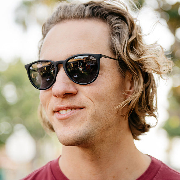 Man wearing Knockaround Black on Black Mary Janes Sunglasses