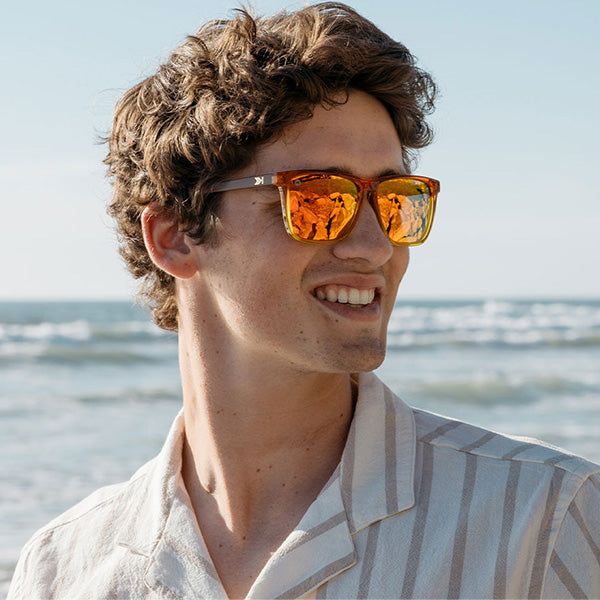 Man wearing Knockaround Firewood Fast Lanes Sunglasses