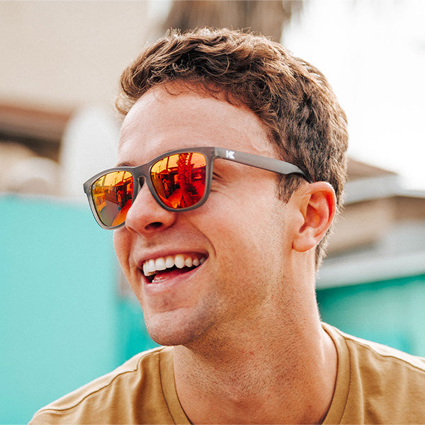 Men wearing Knockaround Frosted Grey Red Sunset Classics Sunglasses