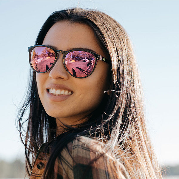 Woman wearing Knockaround Midnight Snack Mai Tais Sunglasses