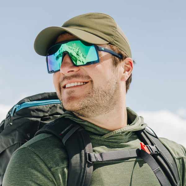 Male wearing Knockaround Sunglasses in the snow