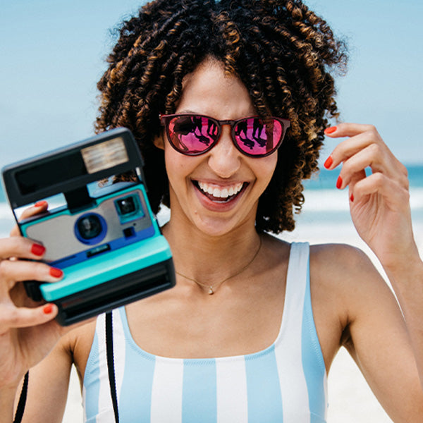 Woman wearing Knockaround Watermelon Geode Mai Tais Sunglasses