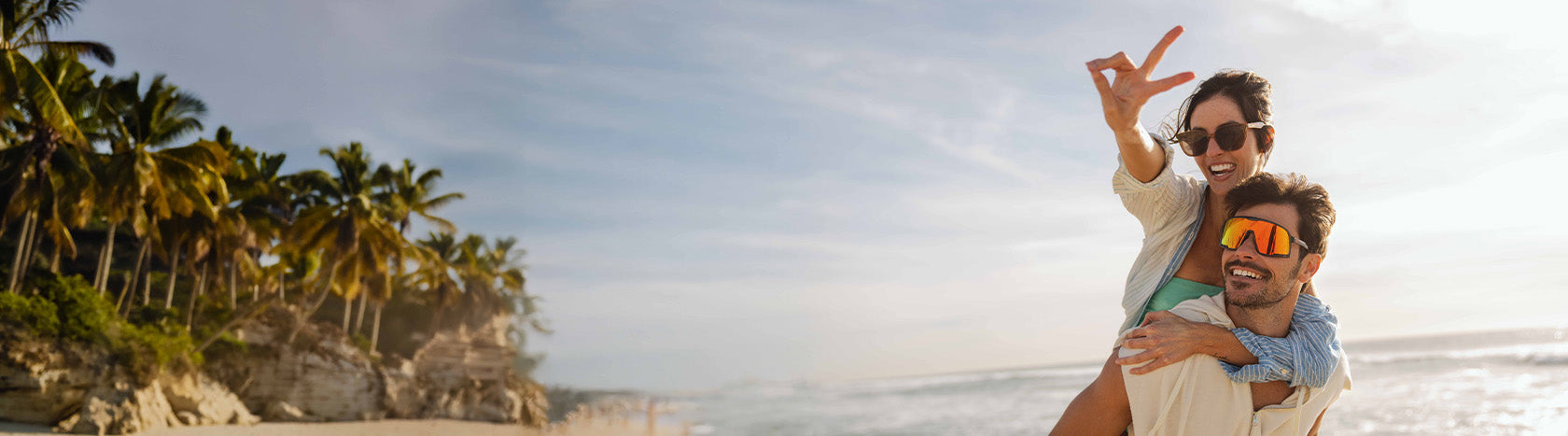 Couple wearing sunglasses on the beach