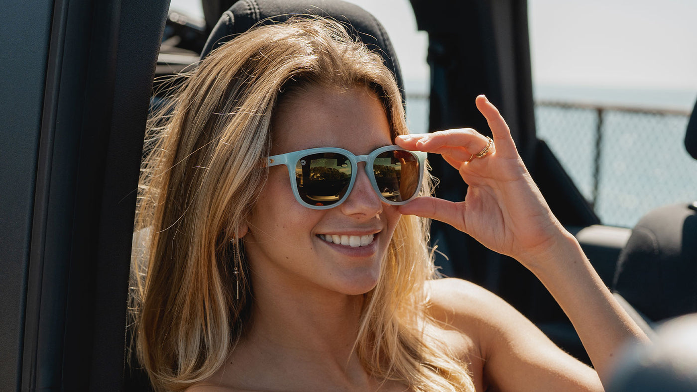 Sunglasses with Light Blue Frames and Polarized Gold Lenses, Model