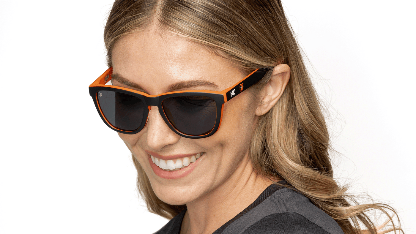 Woman wearing MLB Baltimore Orioles Sunglasses