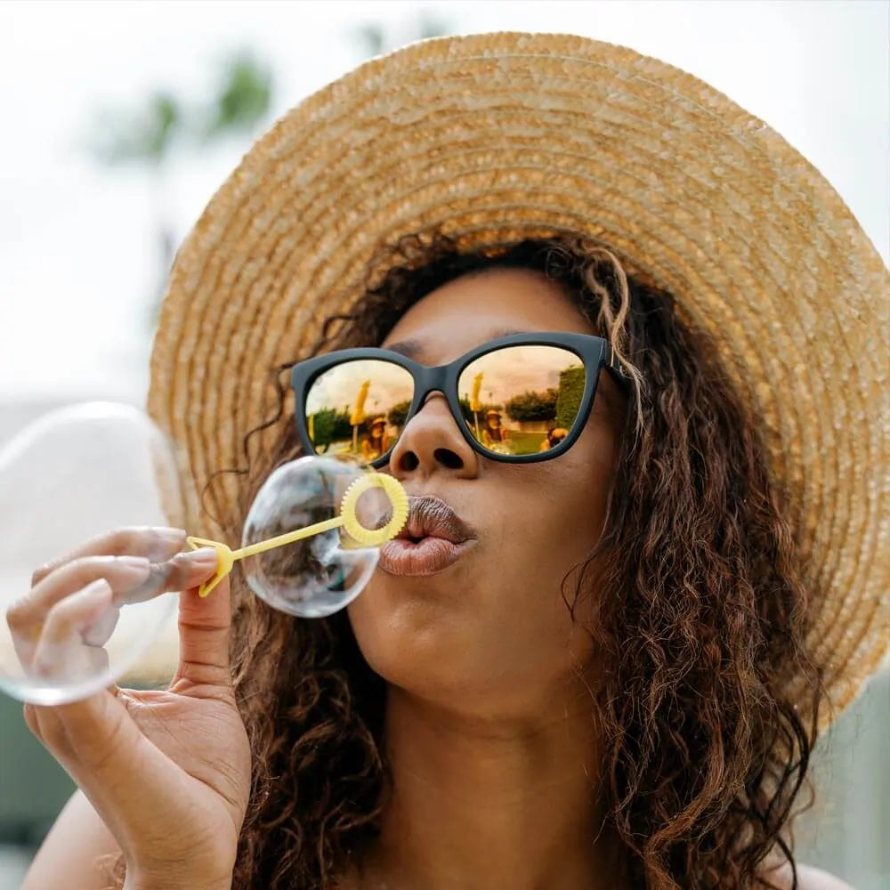 Women wearing Matte Black / Rose Gold Deja Views Sunglasses