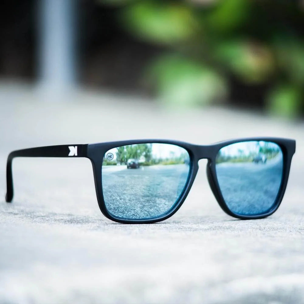 Lifestyle photo of Matte Black / Sky Blue Fast Lanes Sunglasses