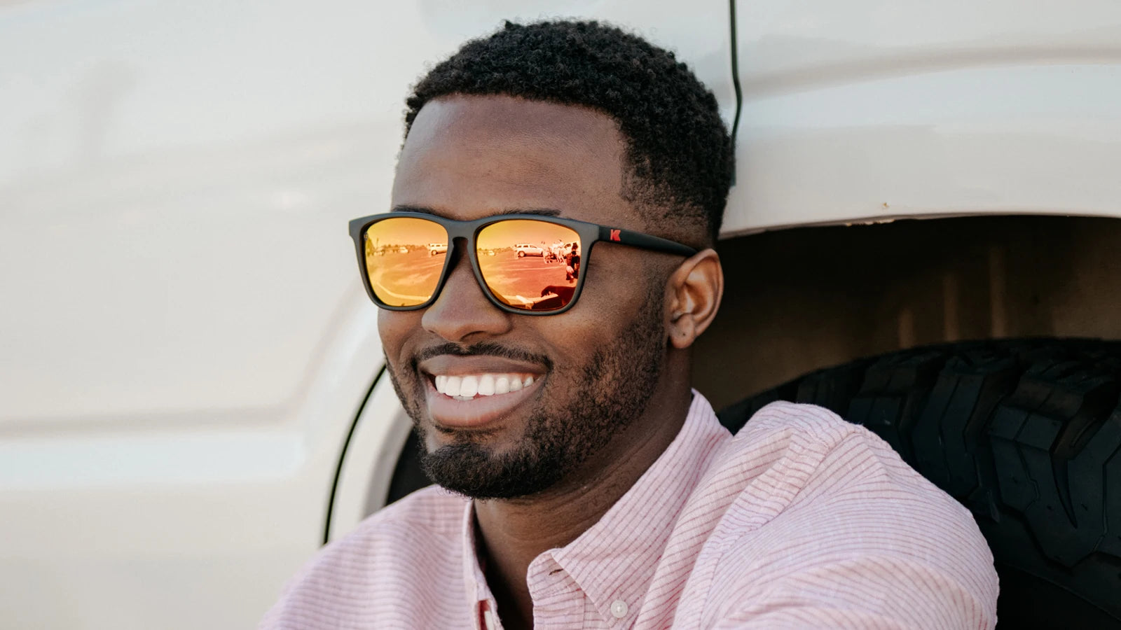 Men wearing Matte Black / Red Sunset Fast Lanes Sunglasses