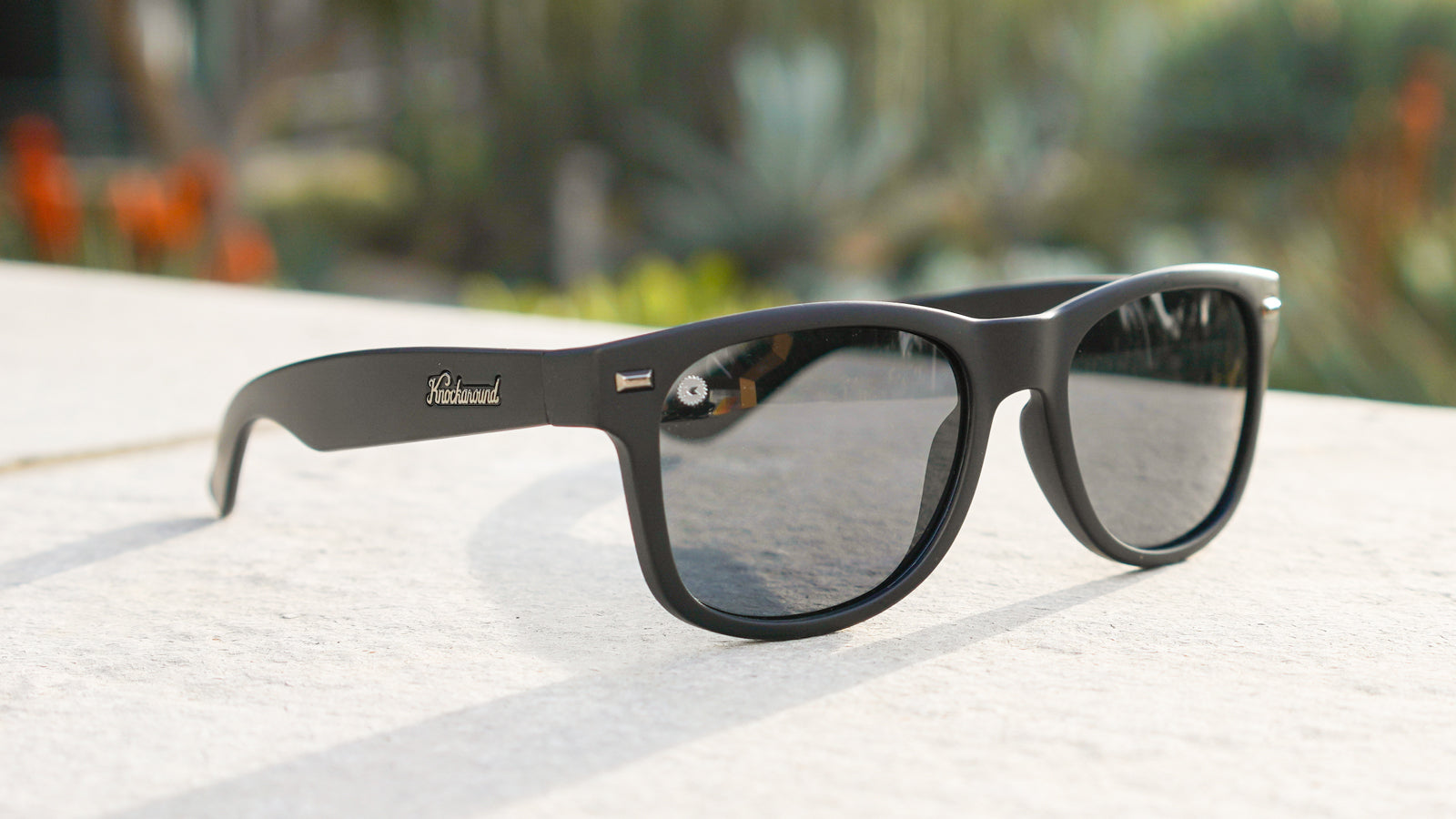 Lifestyle photo of Black on Black Fort Knocks Sunglasses