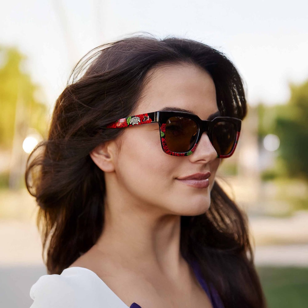 Woman wearing Knockaround Grateful Dead Roses Sunglasses