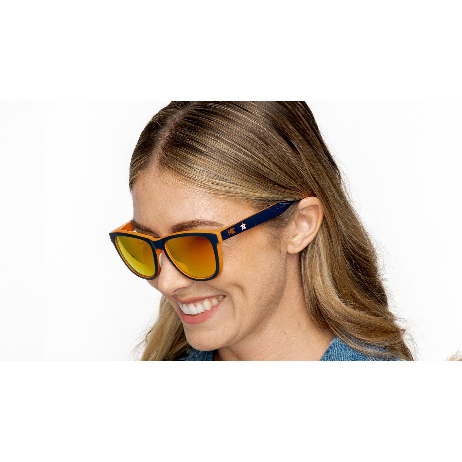Woman wearing MLB Houston Astros Sunglasses