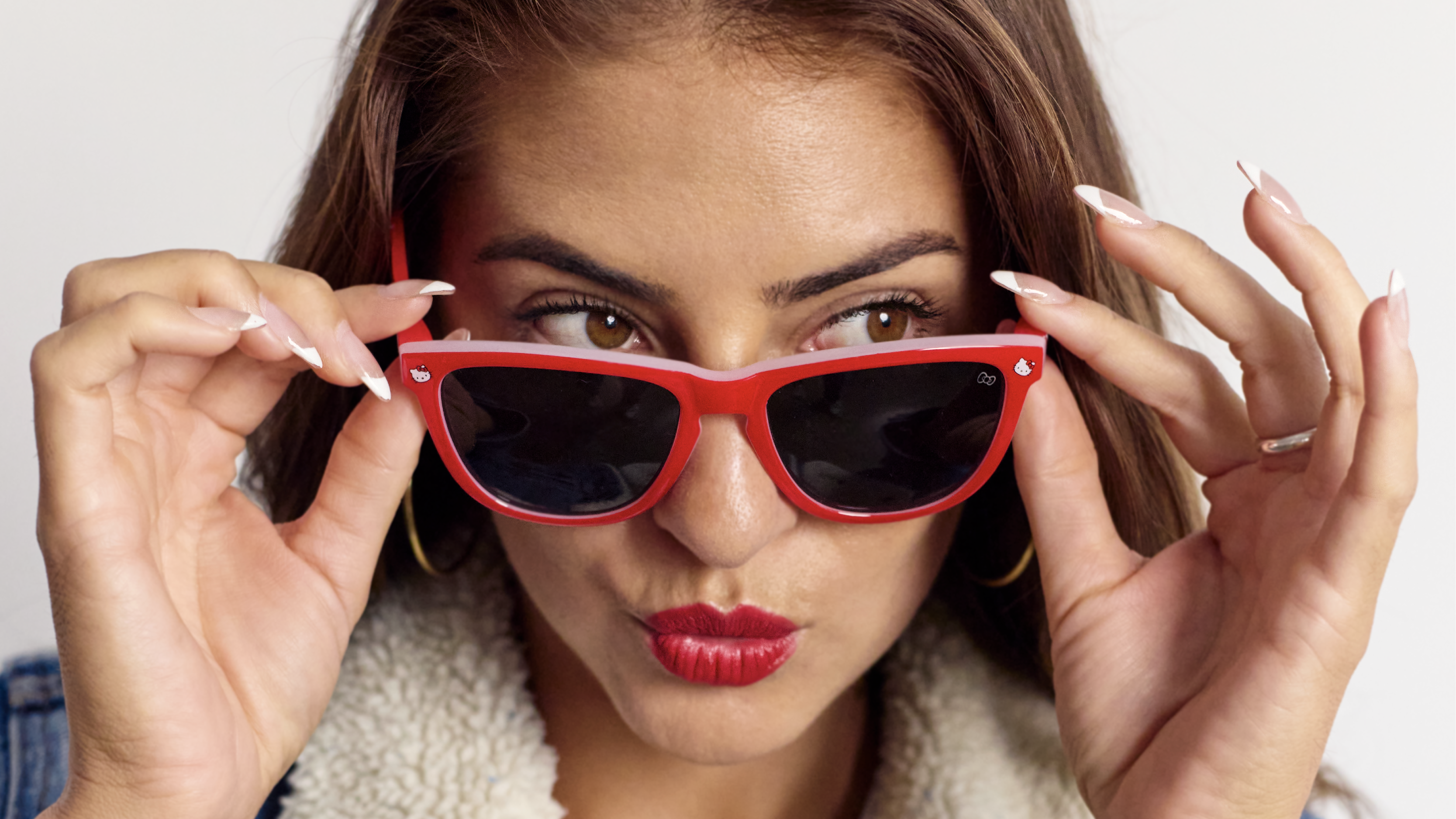 Women wearing Knockaround and Hello Kitty Premiums Sunglasses