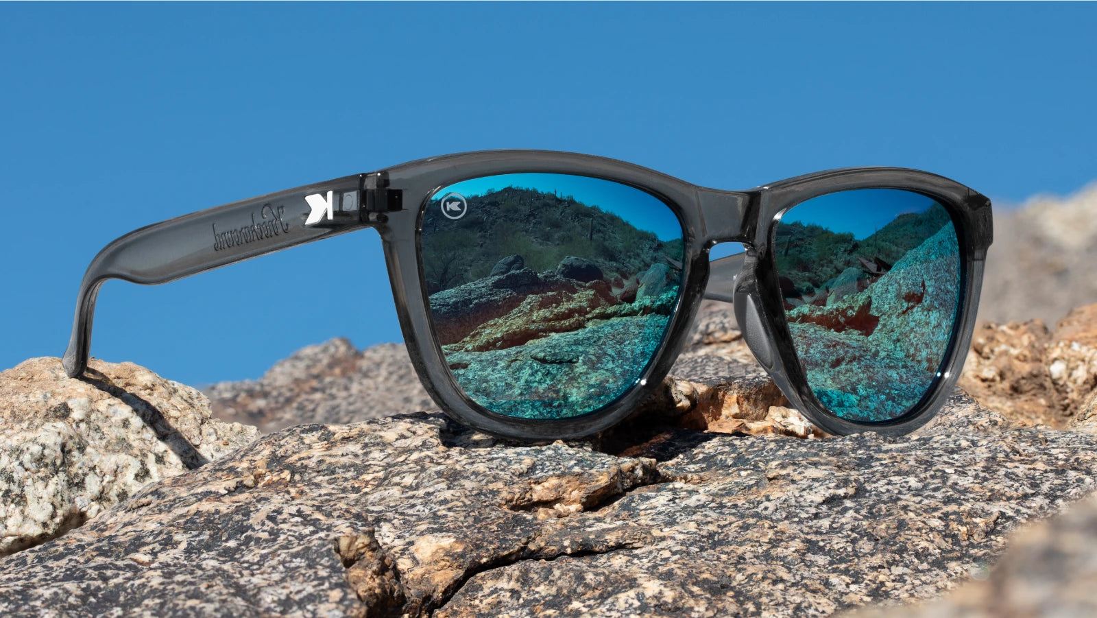 Lifestyle photo of Clear Grey / Aqua Premiums Sport Sunglasses