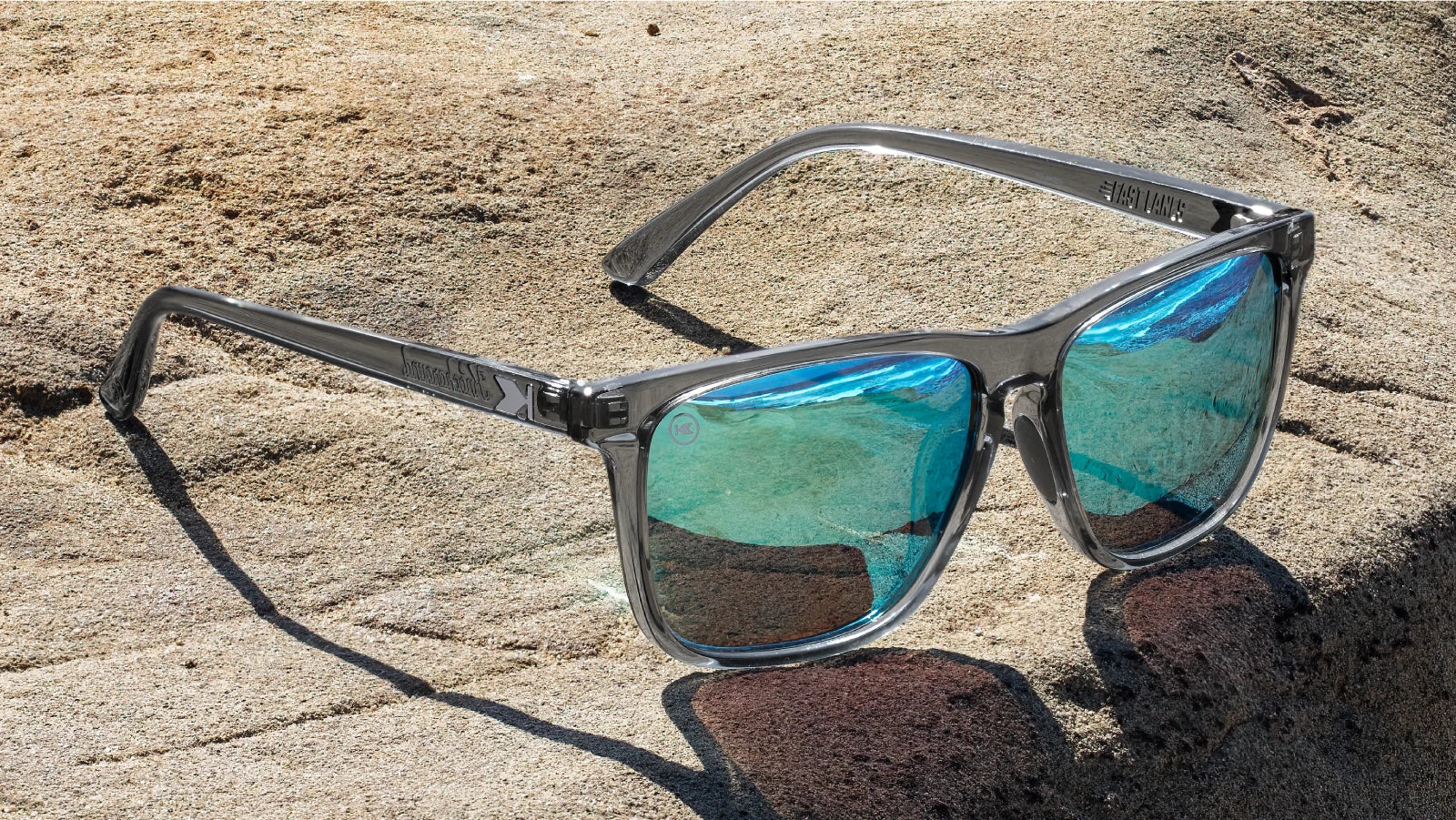 Lifestyle photo of Clear Grey / Aqua Fast Lanes Sport Sunglasses