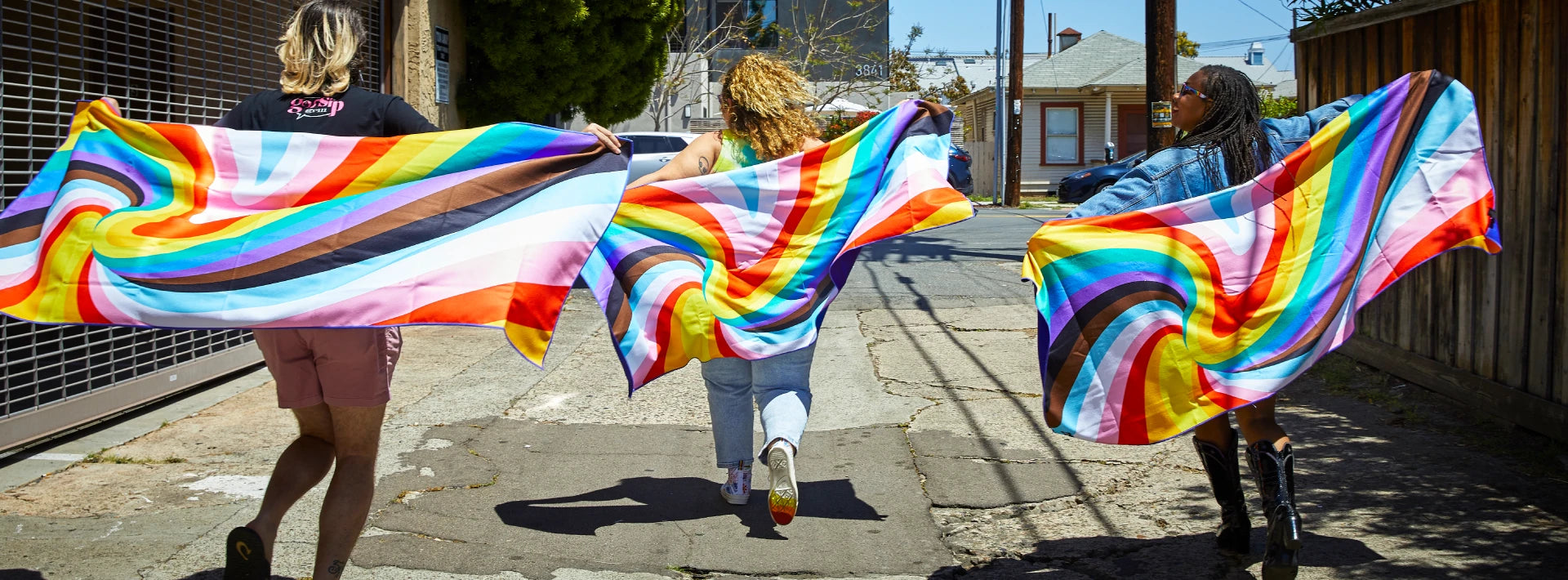 People running with Pride Loud and Proud Adventure Towels