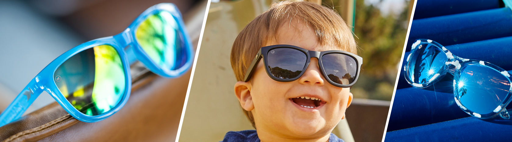 Kids Polarized Sunglasses. Lifestyle photo of Rainbow Blues and Head in the Clouds Kids Premiums Sunglasses, Boy wearing Black on Black Kids Premiums Sunglasses