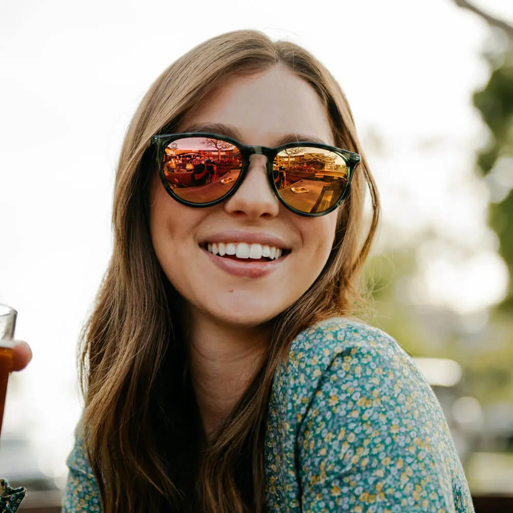 Woman wearing Slate Tortoise Shell Rose Gold Mary Janes sunglasses