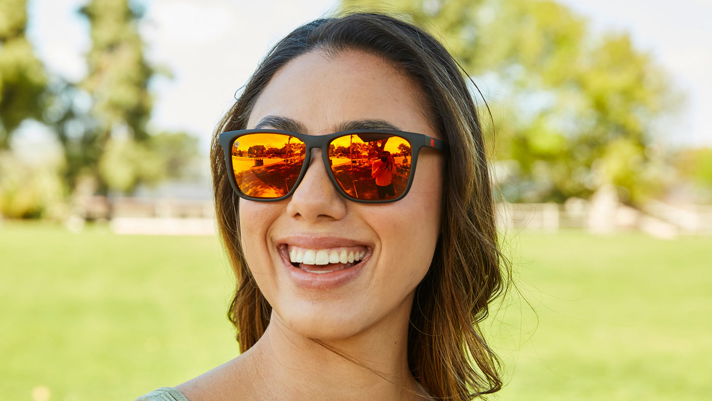 Sunglasses with Matte Black Frames and Polarized Red Sunset Lenses Female Shot