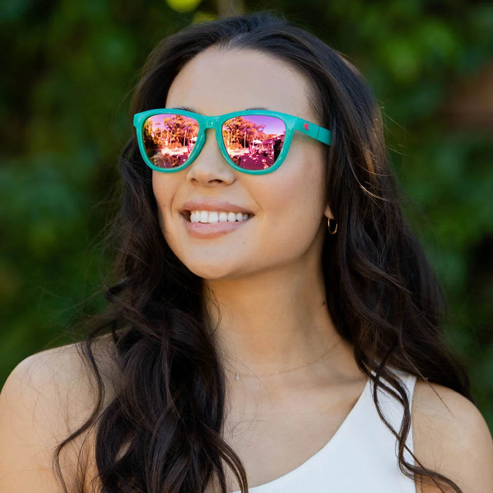 Women wearing Aquamarine / Fuchsia Premiums Sport Sunglasses