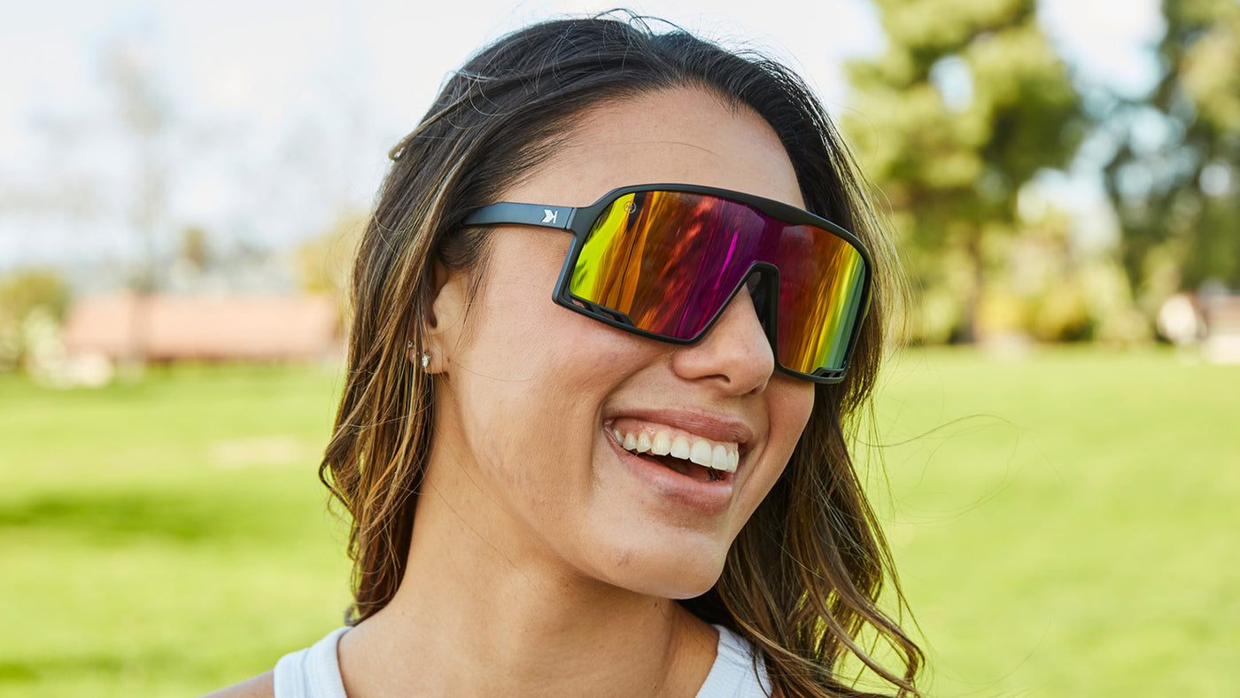 Sport Sunglasses with Matte Black Frames and Rainbow Lenses, Female Model