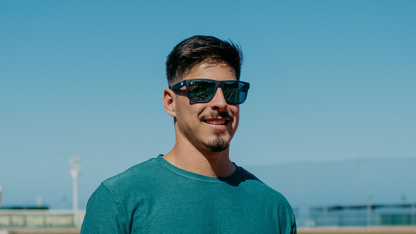 Sunglasses with Navy Frames and Polarized Green Lenses, Model