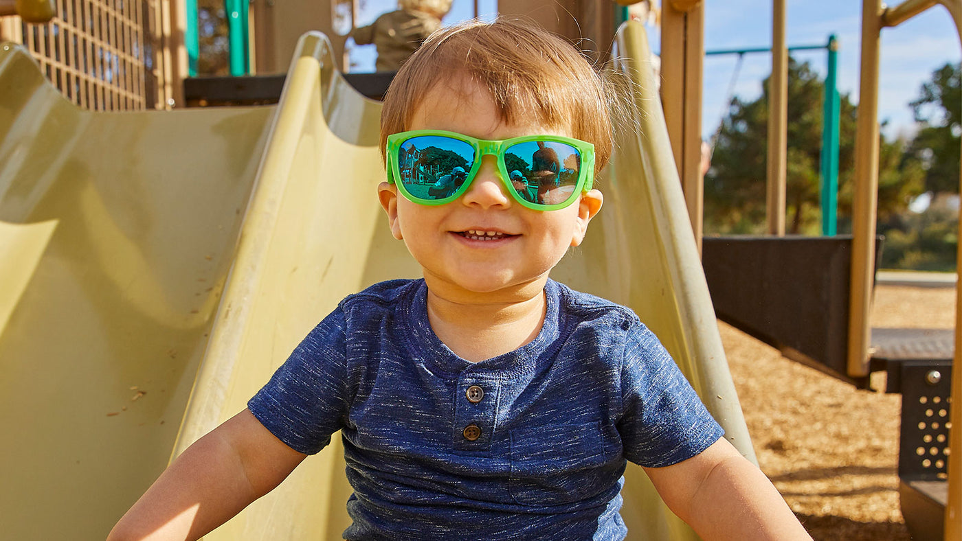 A boy kid wearing sunglasses