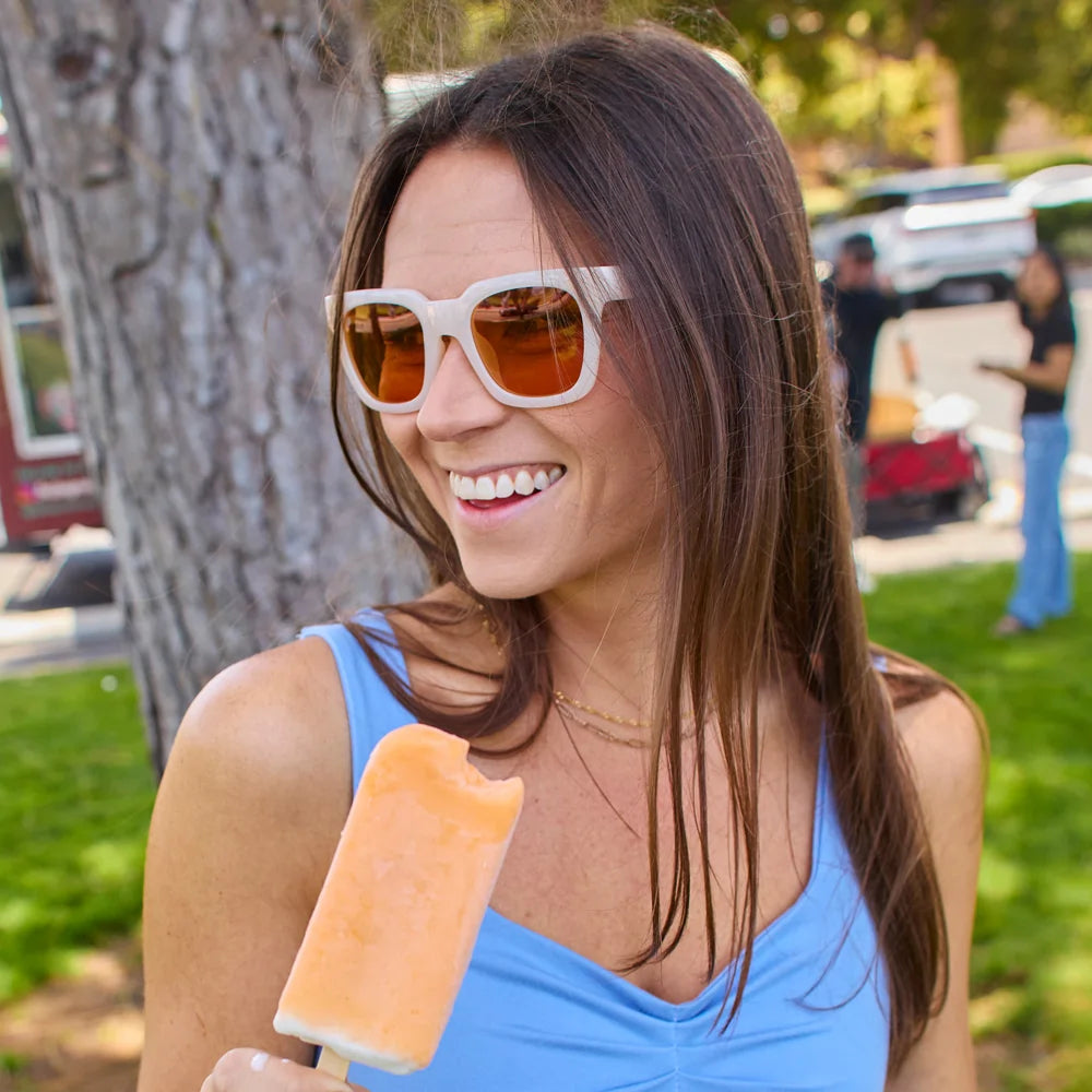Women wearing Orange Dreamsicle Songbirds Sunglasses