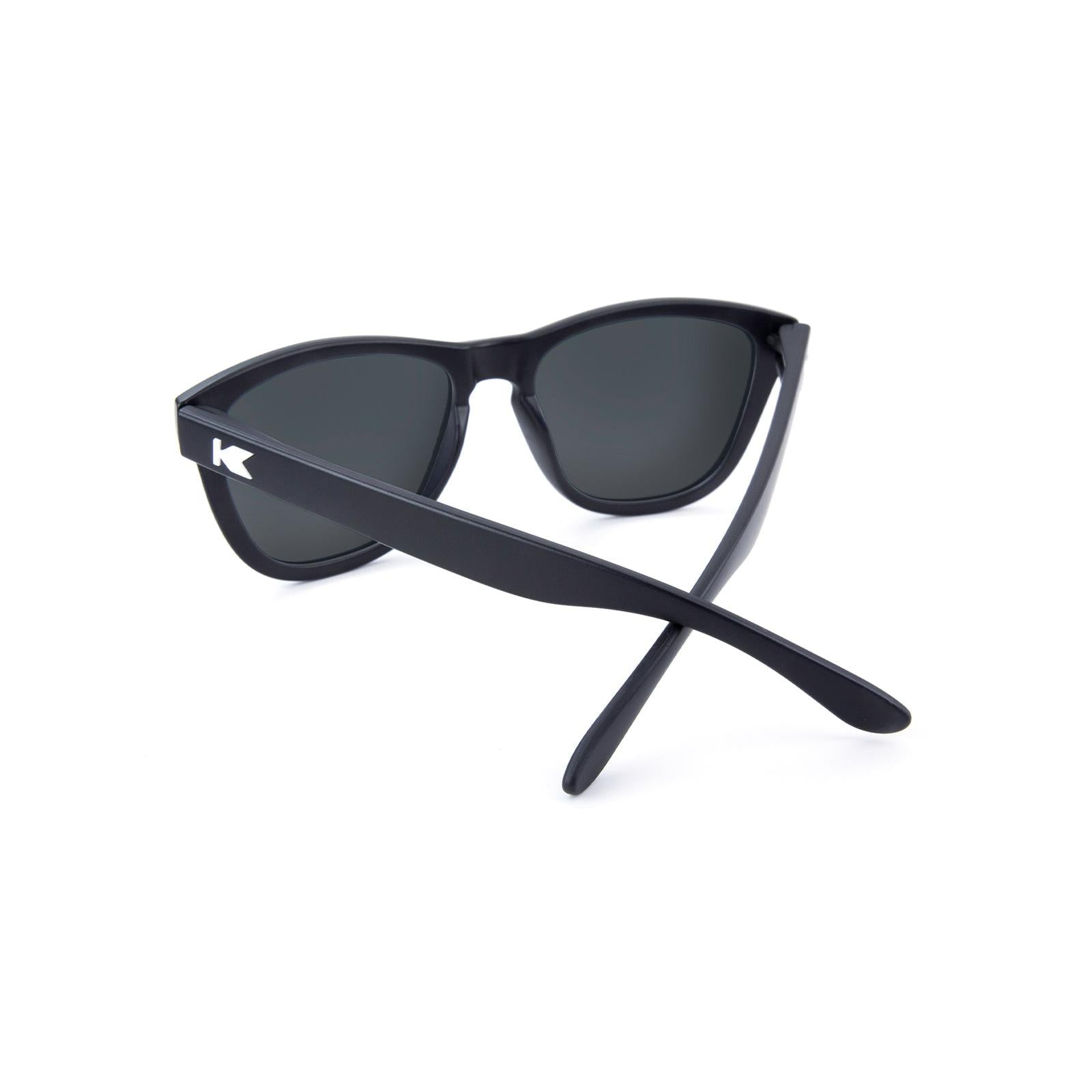 Sunglasses with Matte black frames White K logos Polarized green moonshine mirrored lenses