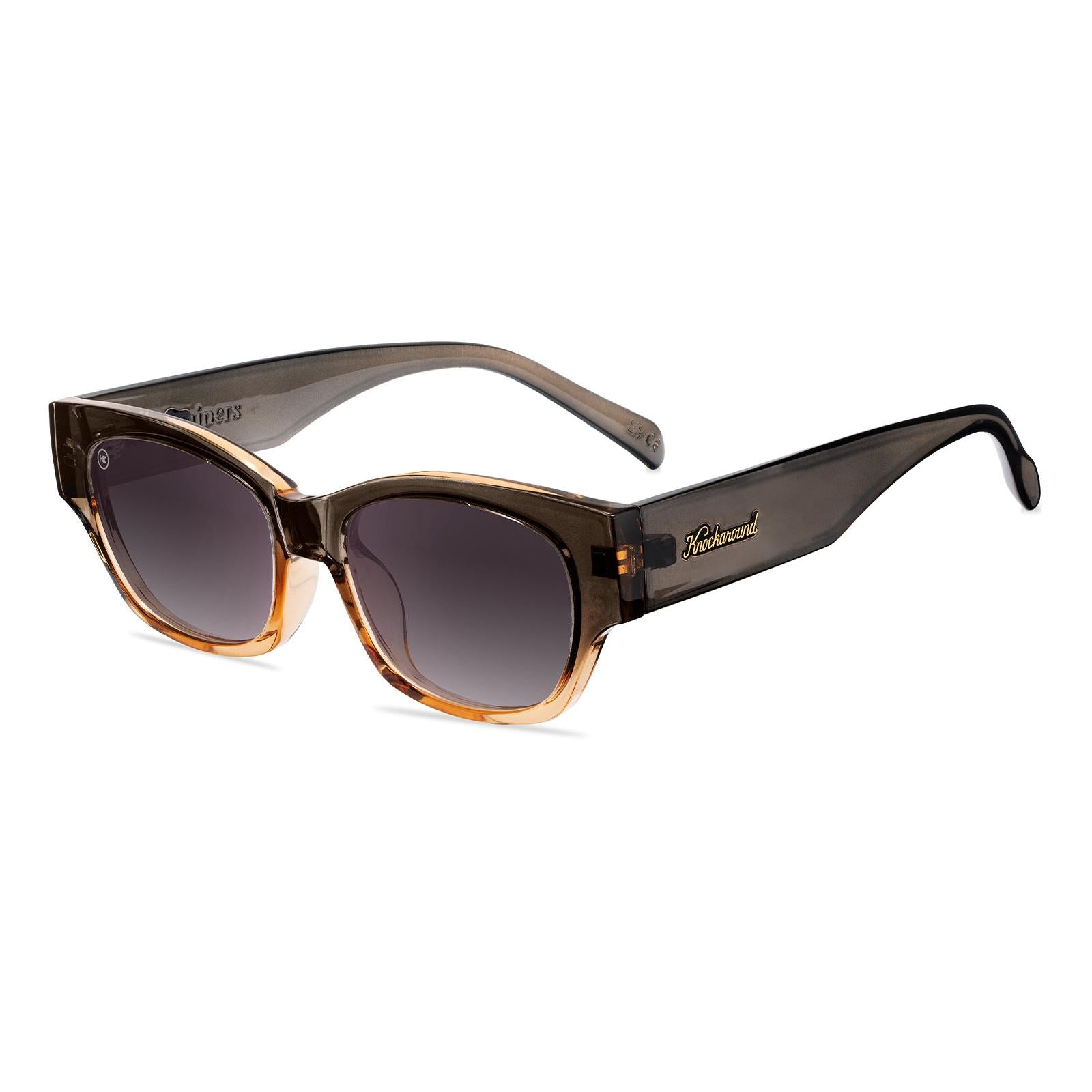 Sunglasses with a glossy muted-gray-to-peach frame and polarized smoke gradient lenses, Flyover