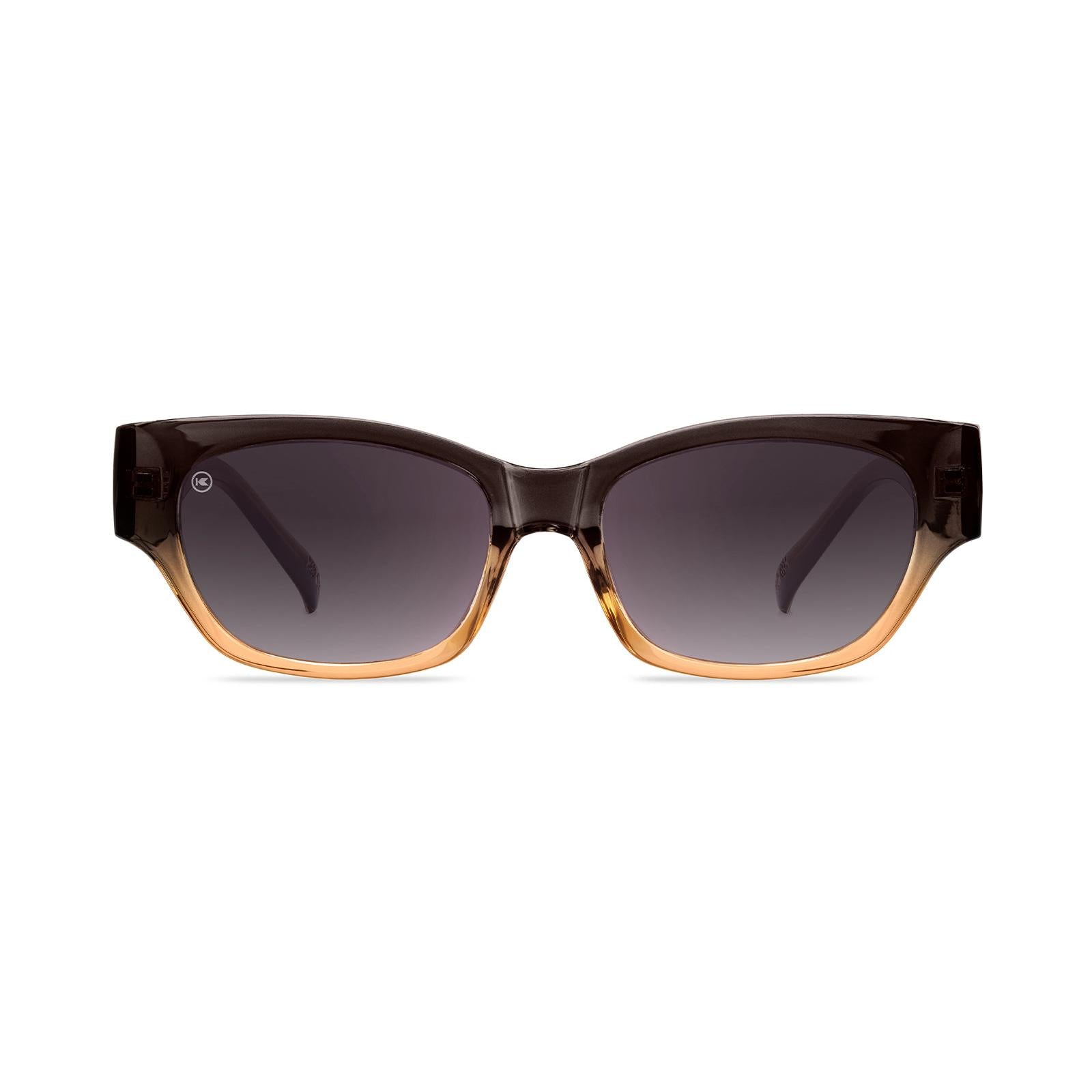 Sunglasses with a glossy muted-gray-to-peach frame and polarized smoke gradient lenses, Front
