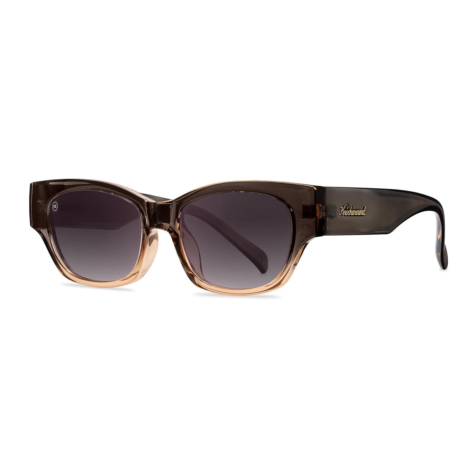 Sunglasses with a glossy muted-gray-to-peach frame and polarized smoke gradient lenses, Threequarter
