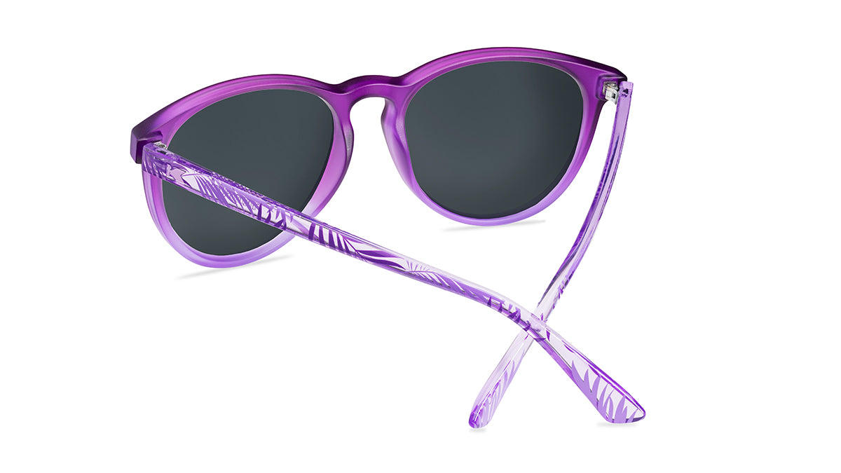 Sunglasses with purple front and palm tree arms, back