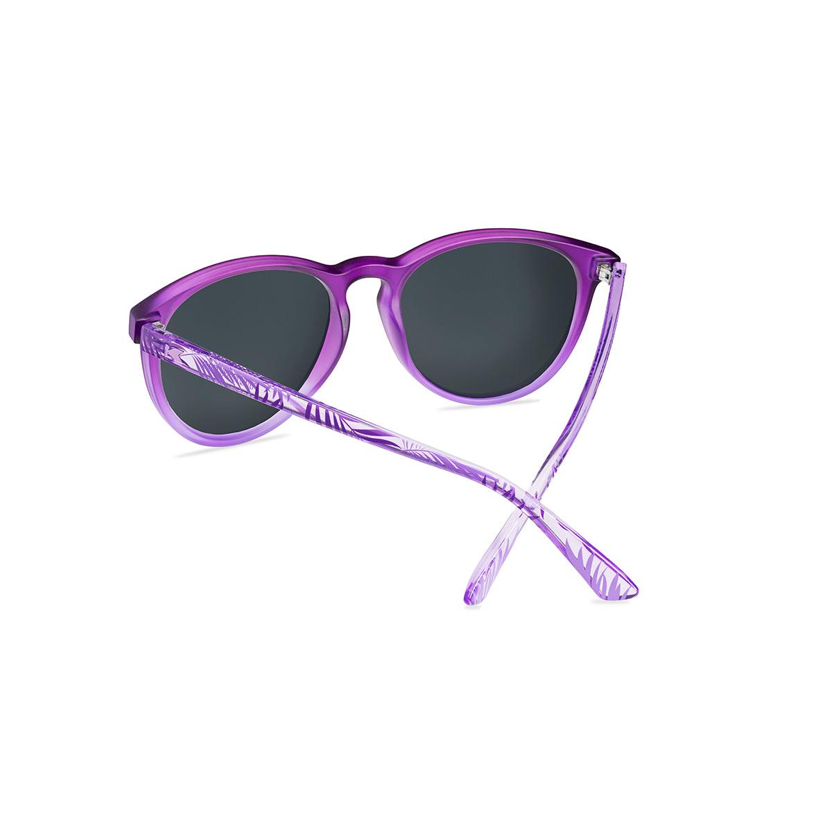 Sunglasses with purple front and palm tree arms, back