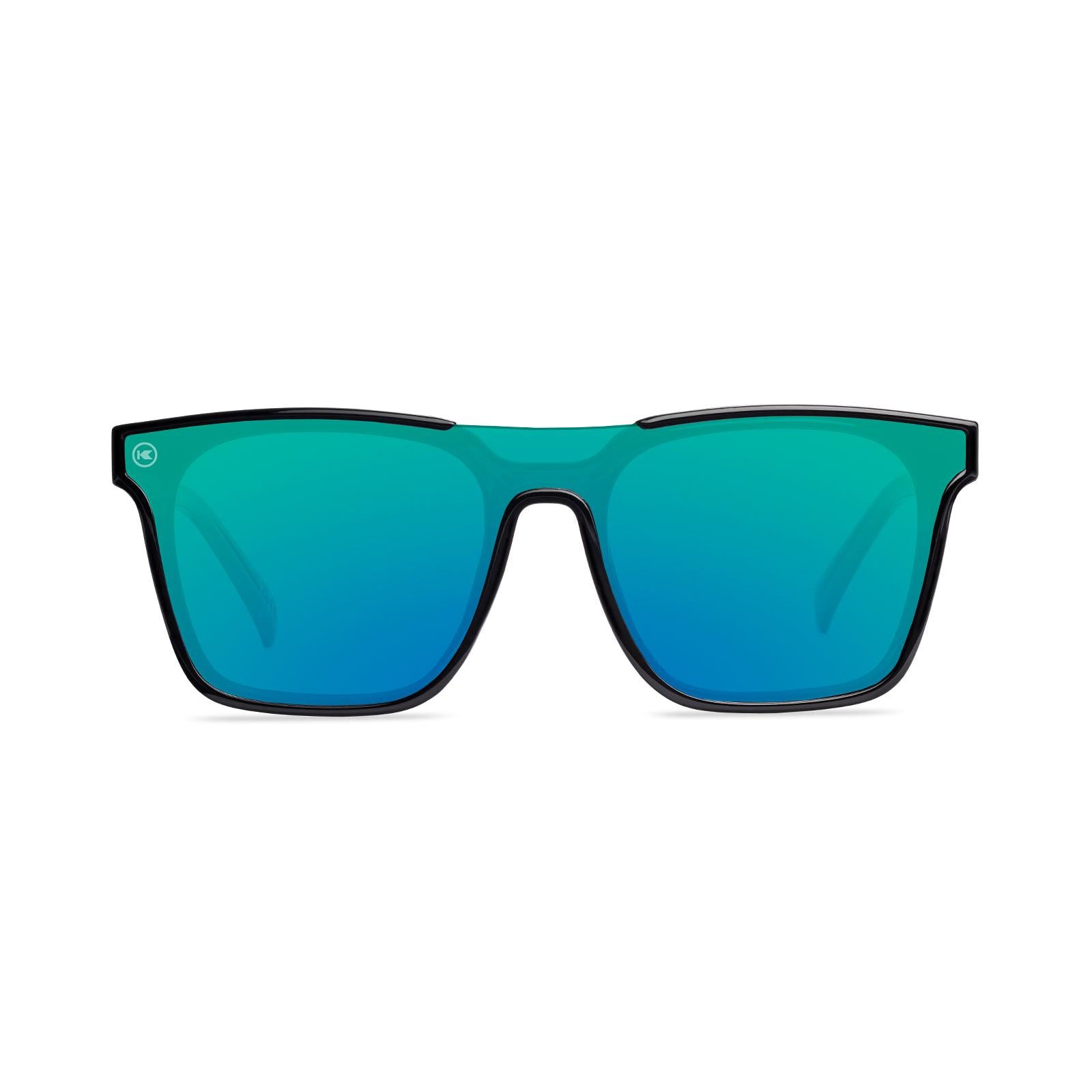 Sunglasses with a black frame with polarized green lenses, front