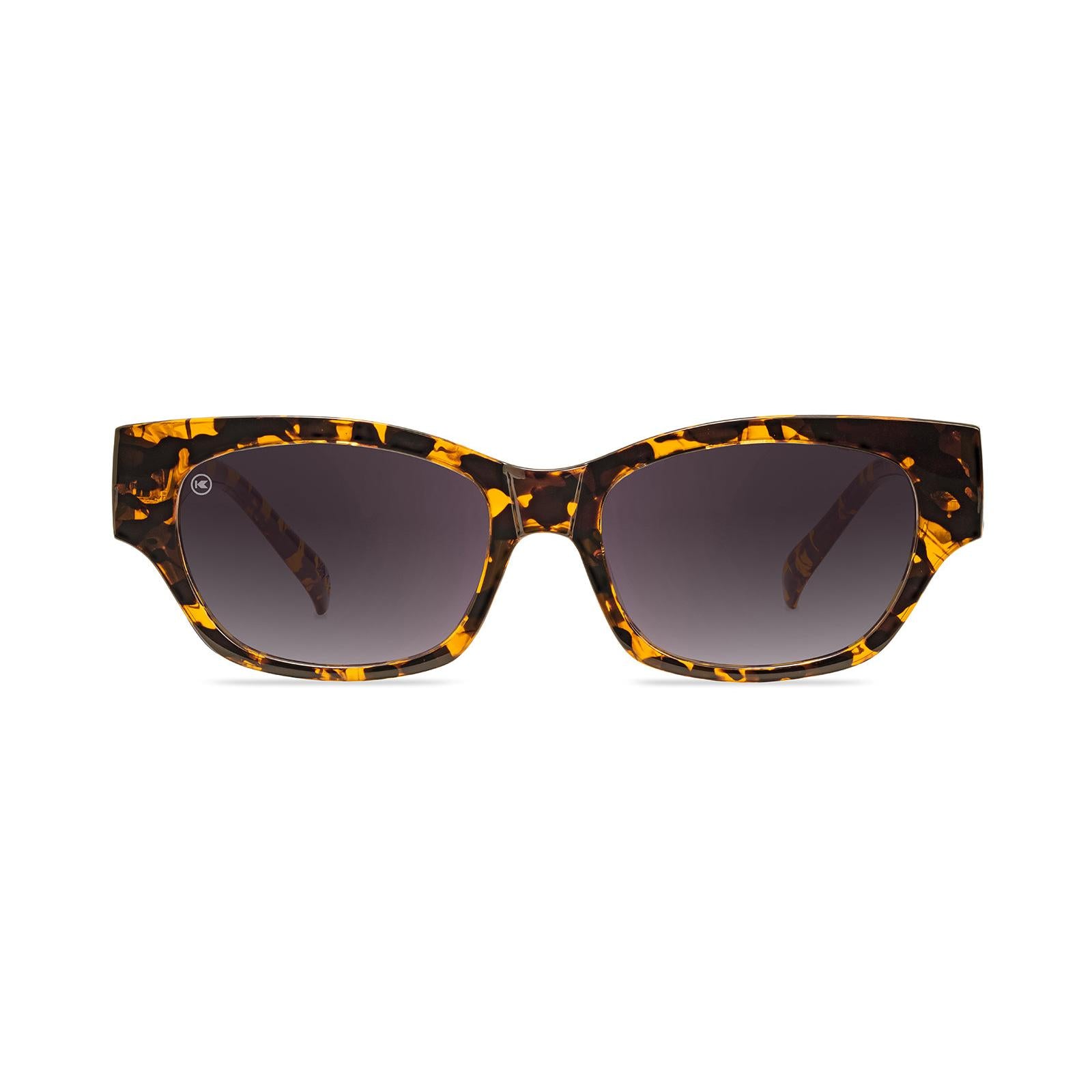 Sunglasses with an inky amber tortoise frame and polarized smoke gradient lenses, Front