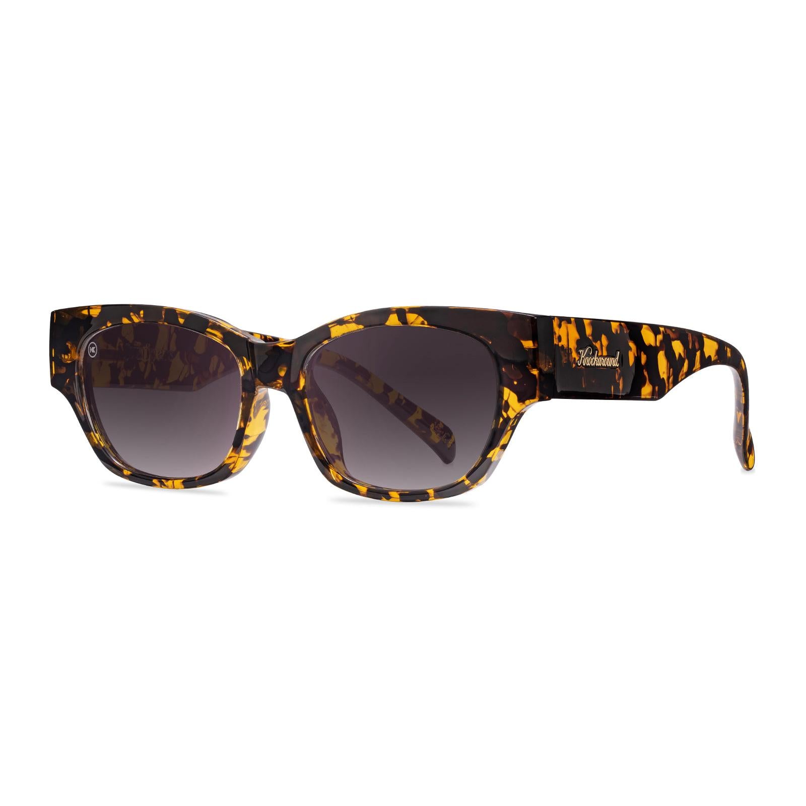 Sunglasses with an inky amber tortoise frame and polarized smoke gradient lenses, Threequarter