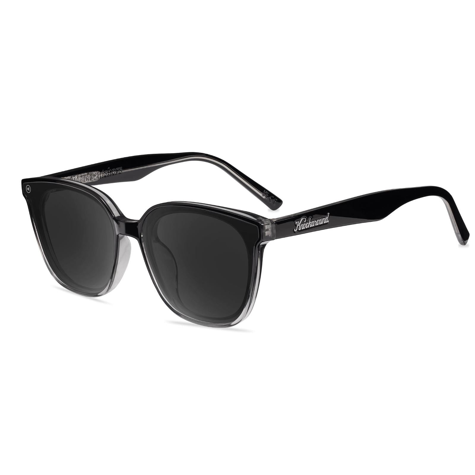 Sunglasses with a black frame with polarized black lenses, flyover
