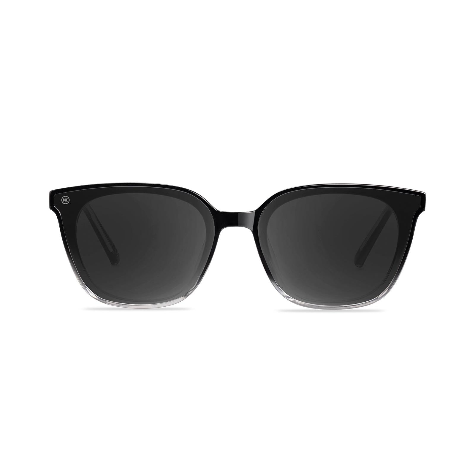 Sunglasses with a black frame with polarized black lenses, front