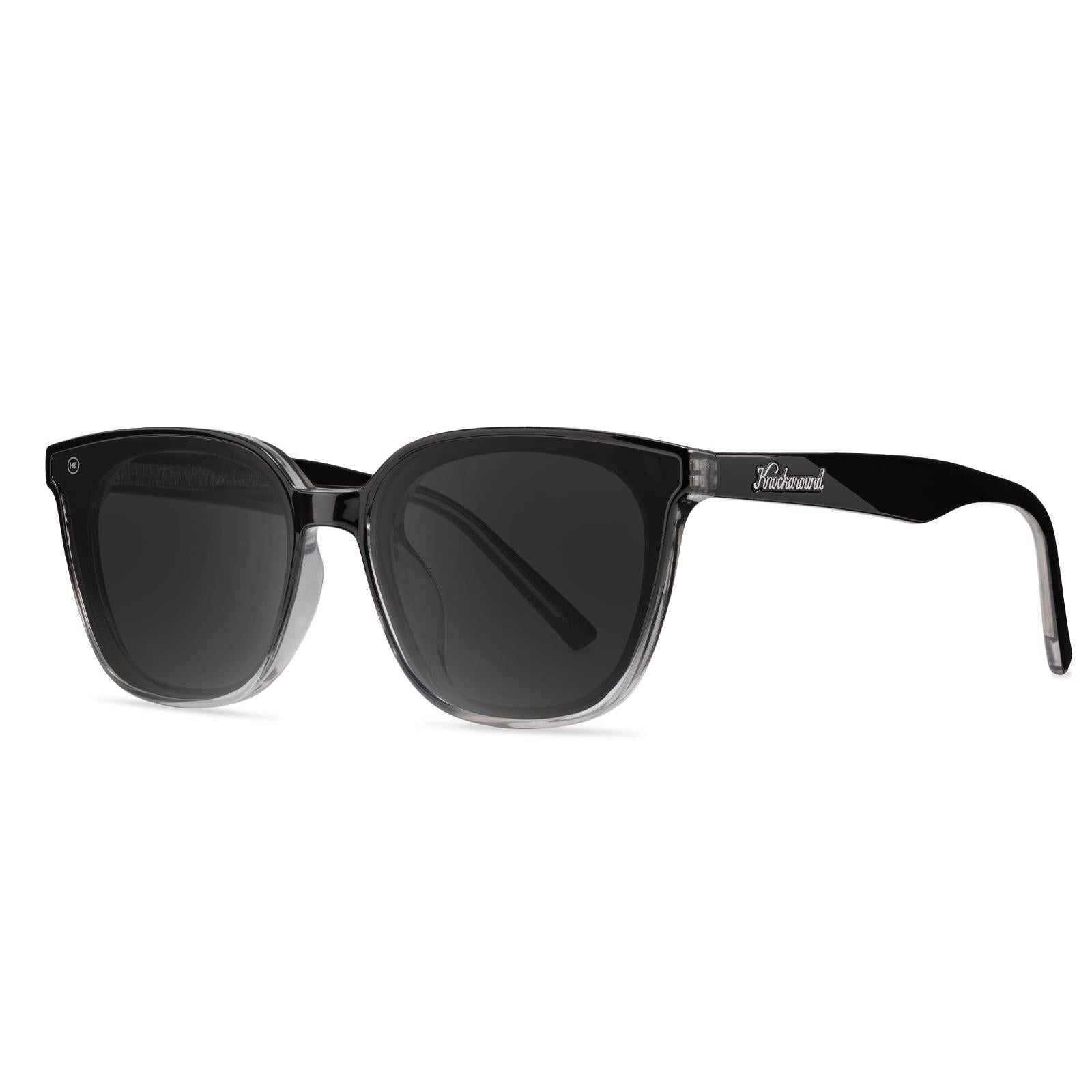 Sunglasses with a black frame with polarized black lenses, threequarter