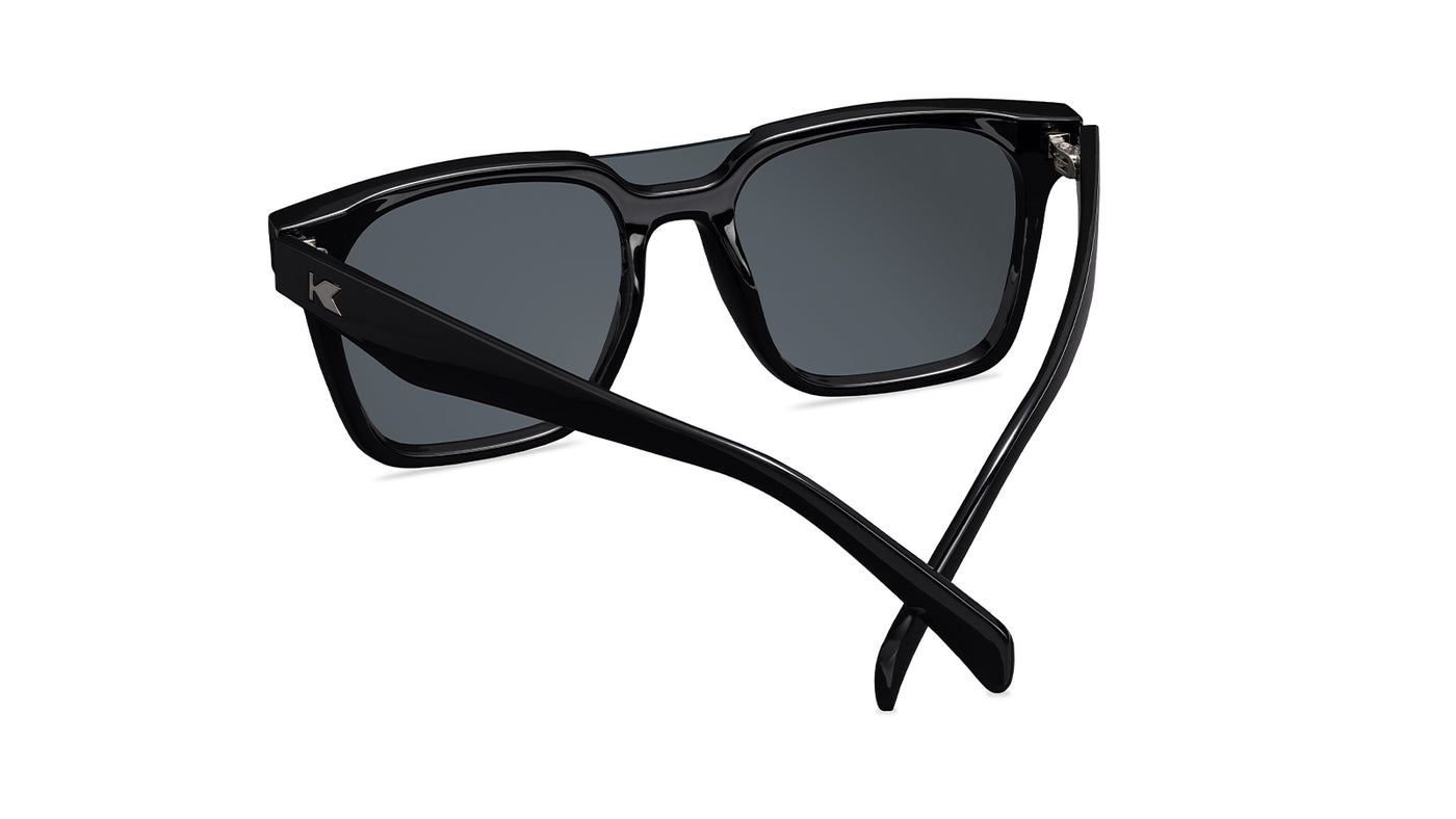 Sunglasses with a black frame with polarized black lenses, back